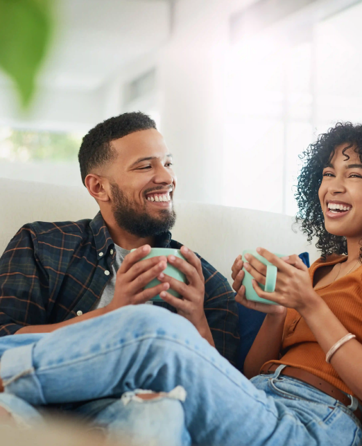 Couple holding mugs